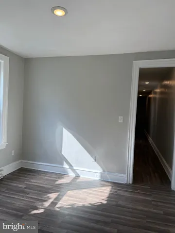 a view of a livingroom with wooden floor
