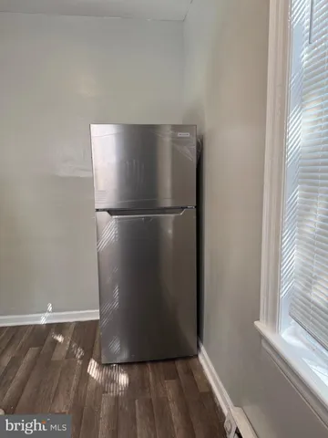 a refrigerator freezer sitting in a kitchen