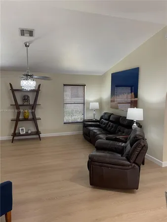 a bedroom with a bed and a mirror
