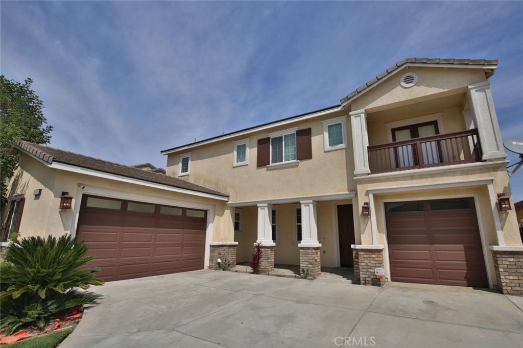 14050 Deepwater Bend Road Eastvale, CA 92880 - Photo 1 of 1 a front view of a house with a garage