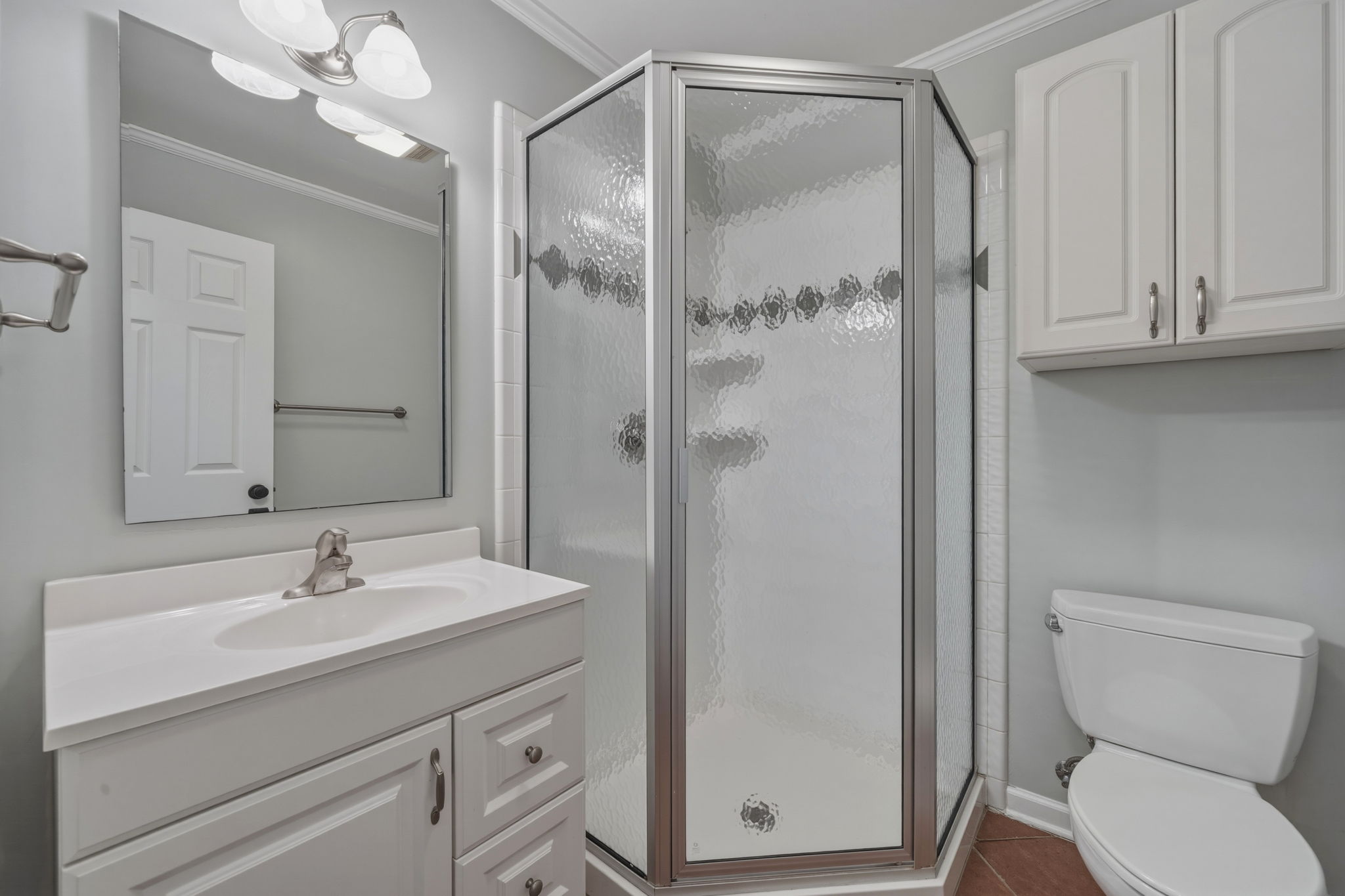 1908 Cullen Avenue Austin, TX 78757 - Photo 18 of 40 a bathroom with a shower sink vanity and toilet