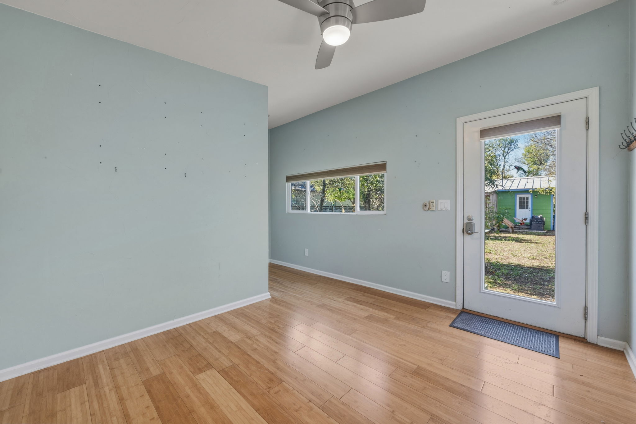 1908 Cullen Avenue Austin, TX 78757 - Photo 25 of 40 an empty room with wooden floor and windows