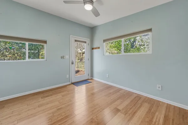 a view of room with window and ceiling fan