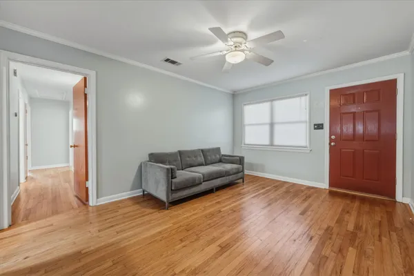 a living room with furniture and a window