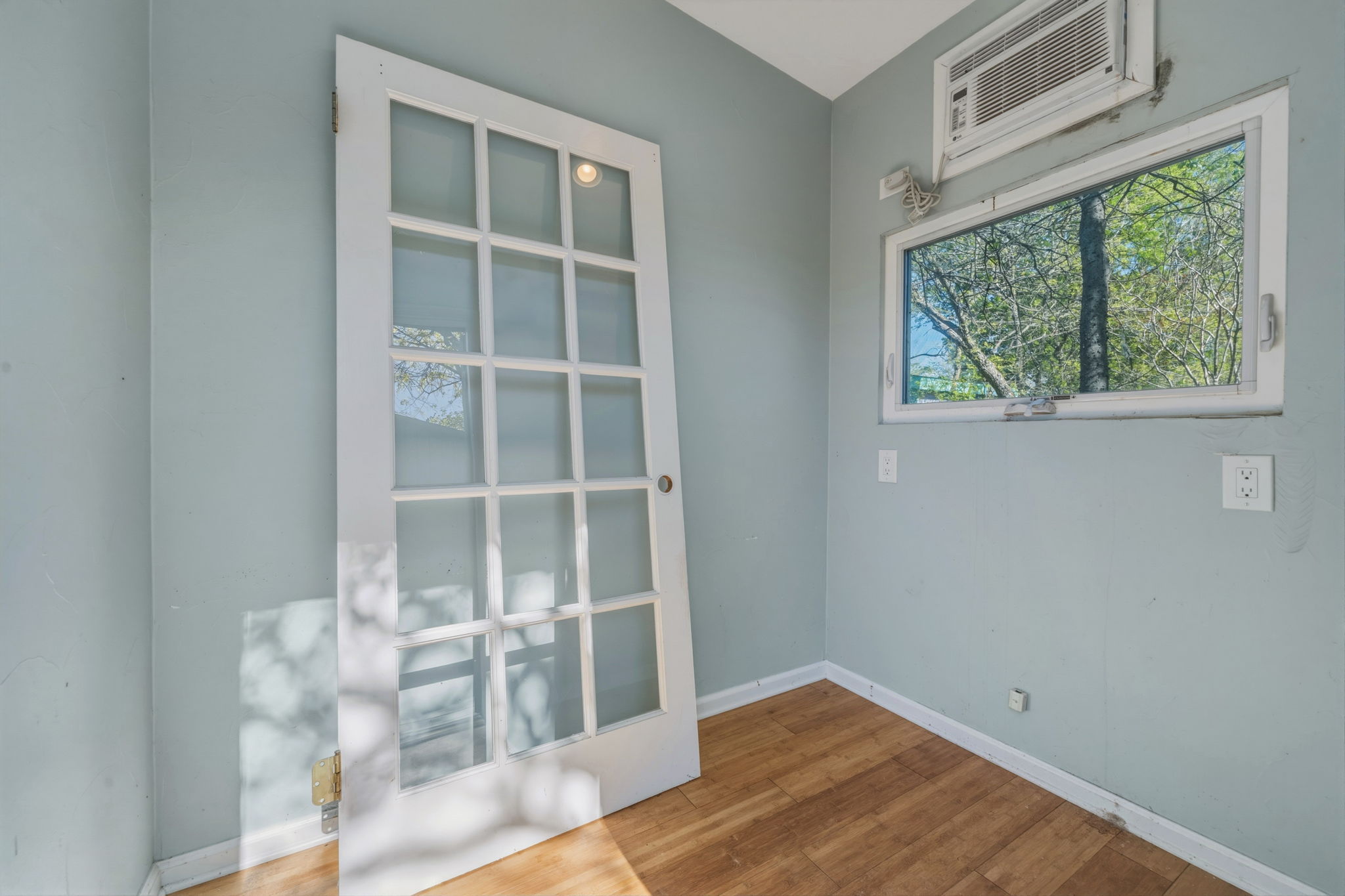 1908 Cullen Avenue Austin, TX 78757 - Photo 36 of 40 a view of empty room with wooden floor and fan