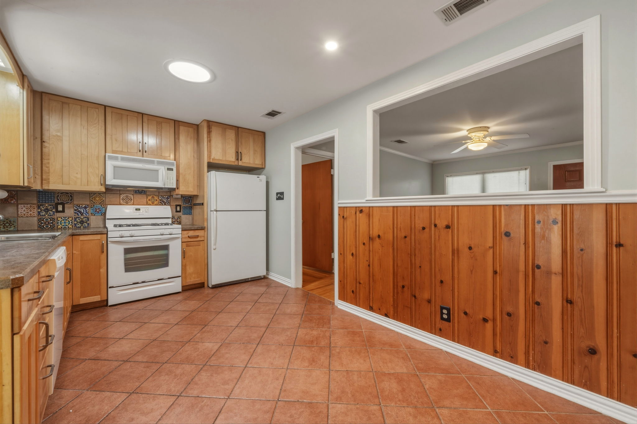 1908 Cullen Avenue Austin, TX 78757 - Photo 4 of 40 a kitchen with stainless steel appliances a refrigerator and cabinets