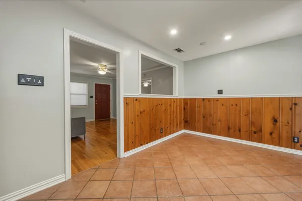 a large bathroom with a sink and a large mirror