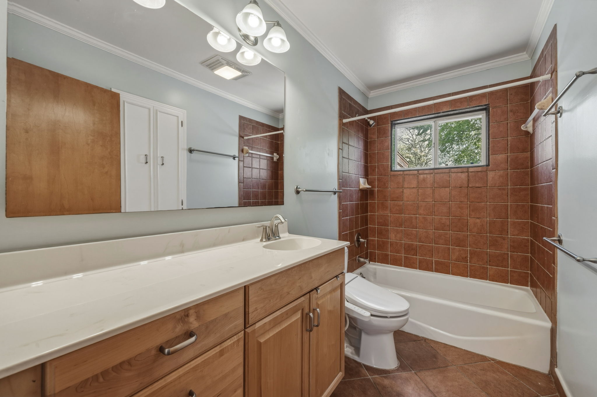 1908 Cullen Avenue Austin, TX 78757 - Photo 8 of 40 a bathroom with a sink a toilet and shower