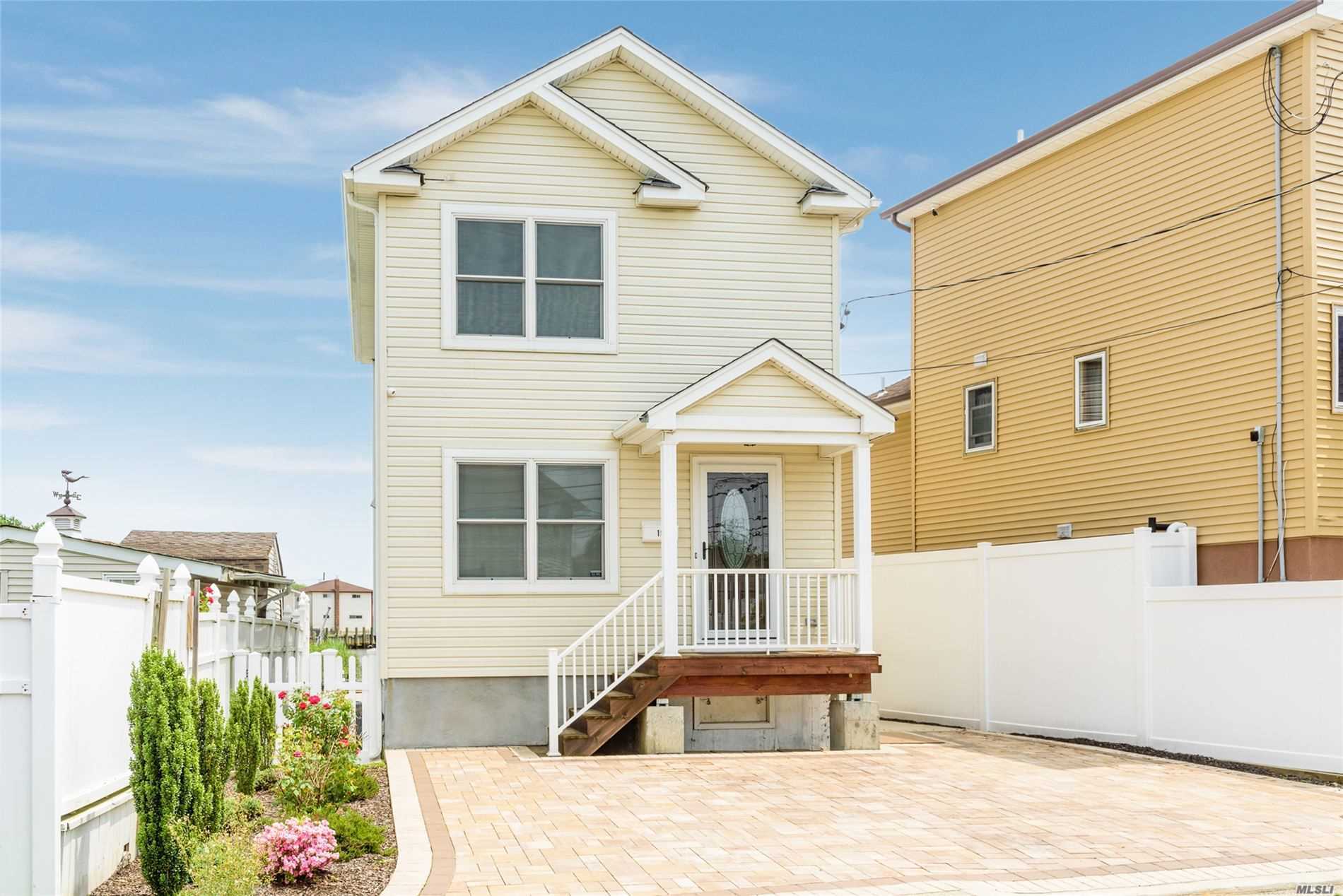 19 N Road Bellmore, NY 11710 - Photo 1 of 1 a front view of a house with a yard