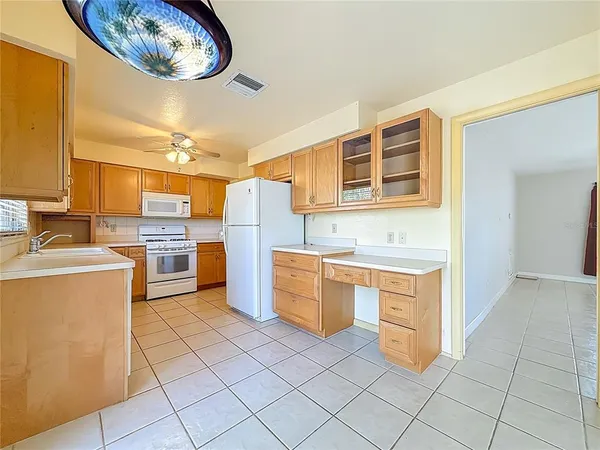a kitchen with a cabinets and appliances
