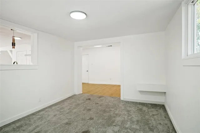 an empty room with a empty space and window