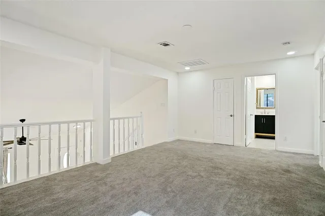 a view of an empty room with a fireplace