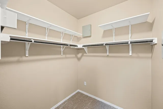 a view of an empty walk in closet