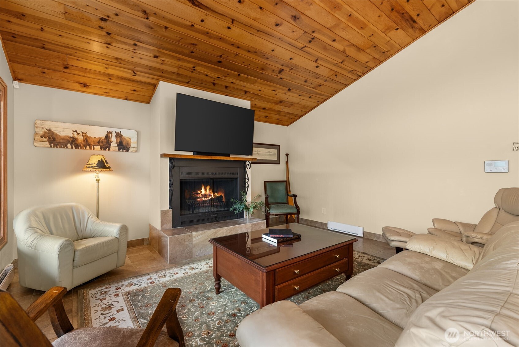 2147 Summit Lake Shore Road Northwest Olympia, WA 98502 - Photo 14 of 38 a living room with furniture and a fireplace