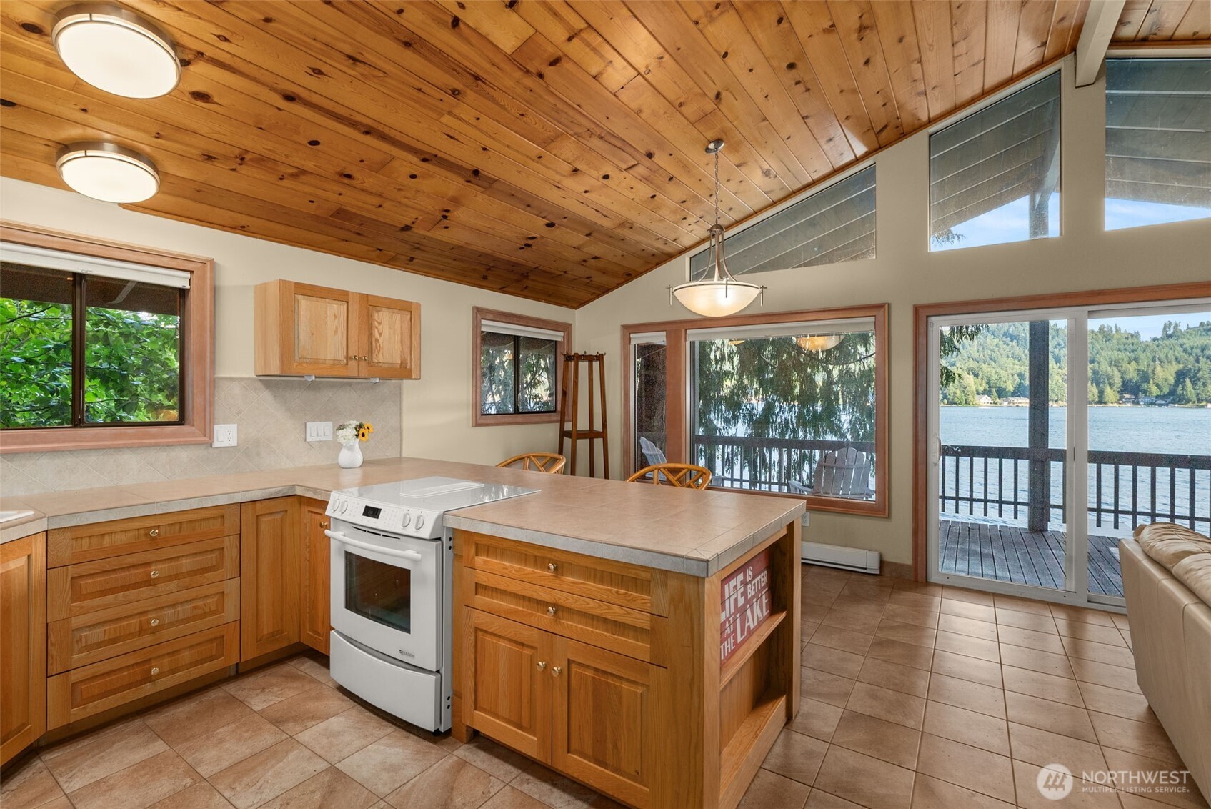 2147 Summit Lake Shore Road Northwest Olympia, WA 98502 - Photo 21 of 38 a kitchen that has a sink and a stove