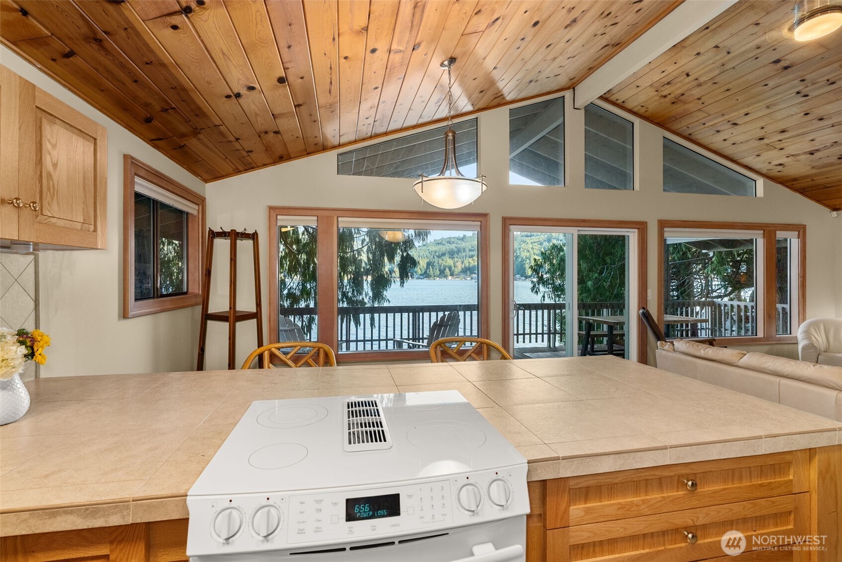 2147 Summit Lake Shore Road Northwest Olympia, WA 98502 - Photo 22 of 38 a view of a patio with a table and chairs