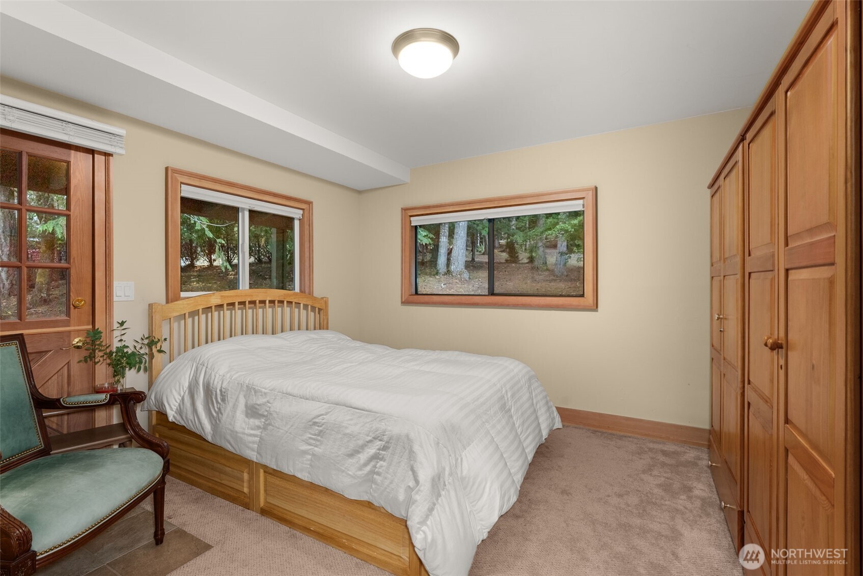 2147 Summit Lake Shore Road Northwest Olympia, WA 98502 - Photo 25 of 38 a bedroom with a bed and window