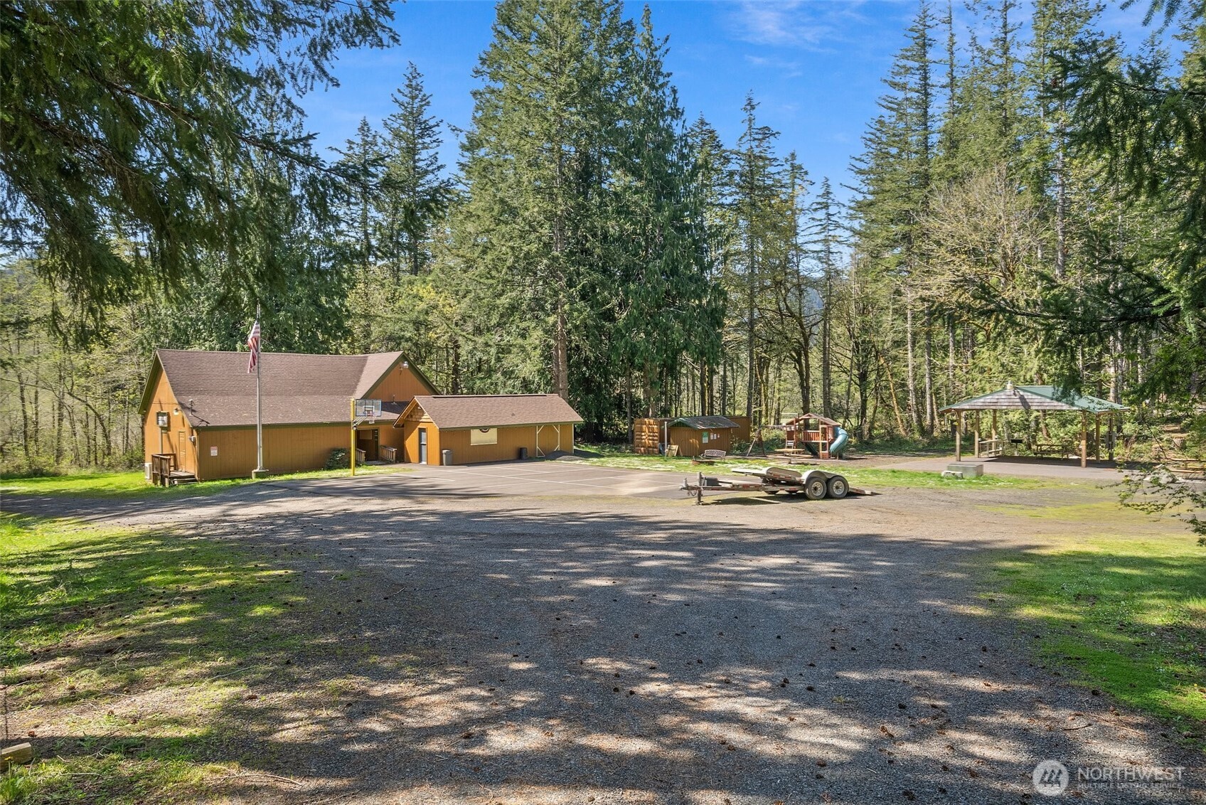 2147 Summit Lake Shore Road Northwest Olympia, WA 98502 - Photo 38 of 38 a view of a house with a big yard and large trees