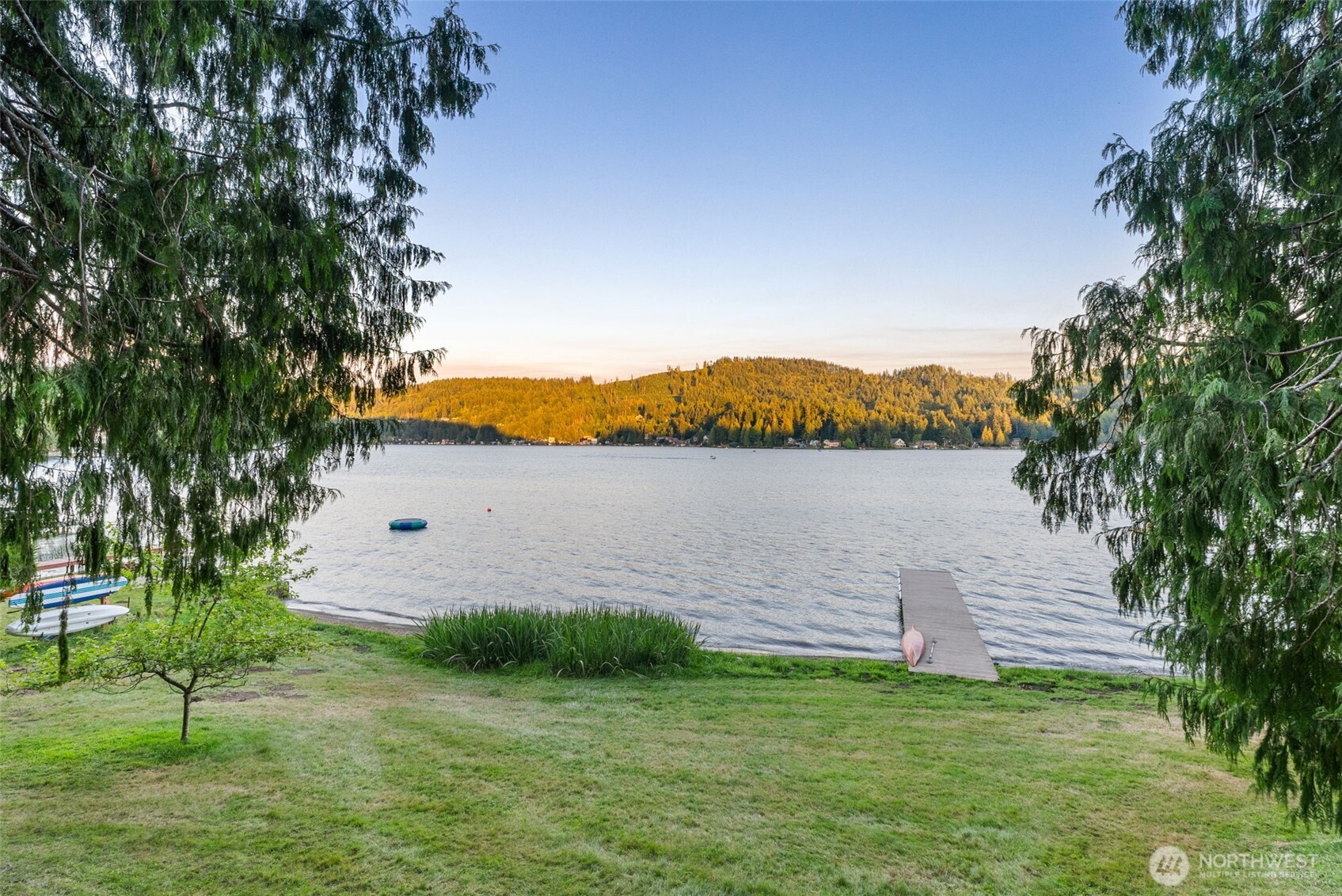 2147 Summit Lake Shore Road Northwest Olympia, WA 98502 - Photo 7 of 38 a view of a lake with a big yard