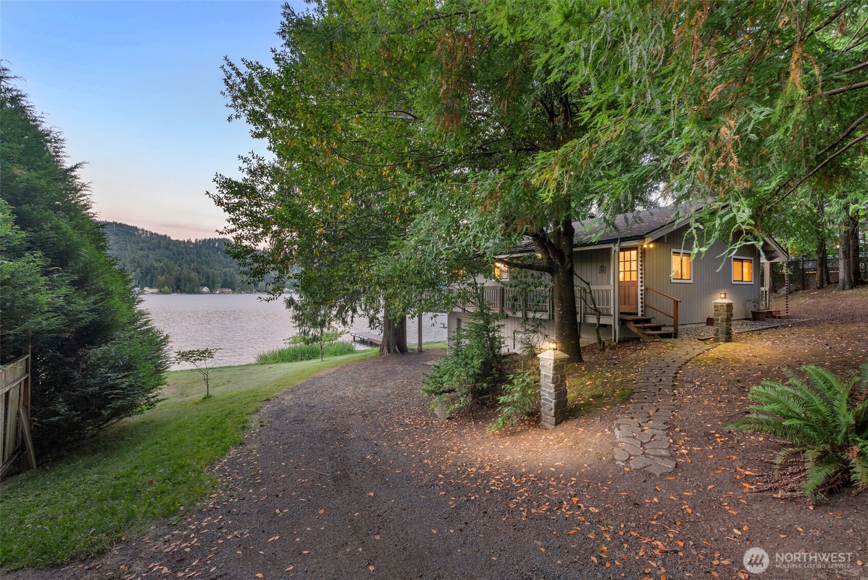 2147 Summit Lake Shore Road Northwest Olympia, WA 98502 - Photo 9 of 38 a view of a road with plants and large trees