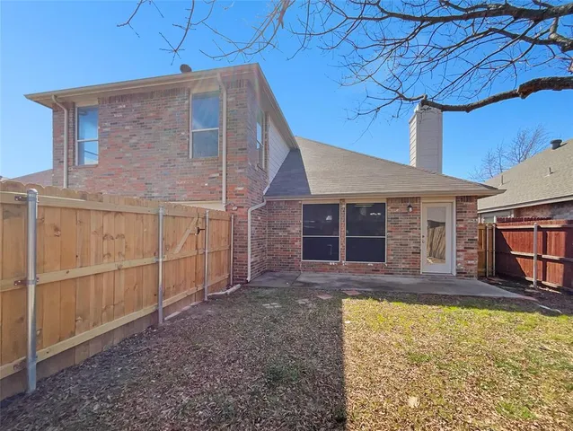 a view of a house with backyard porch and wooden floor
