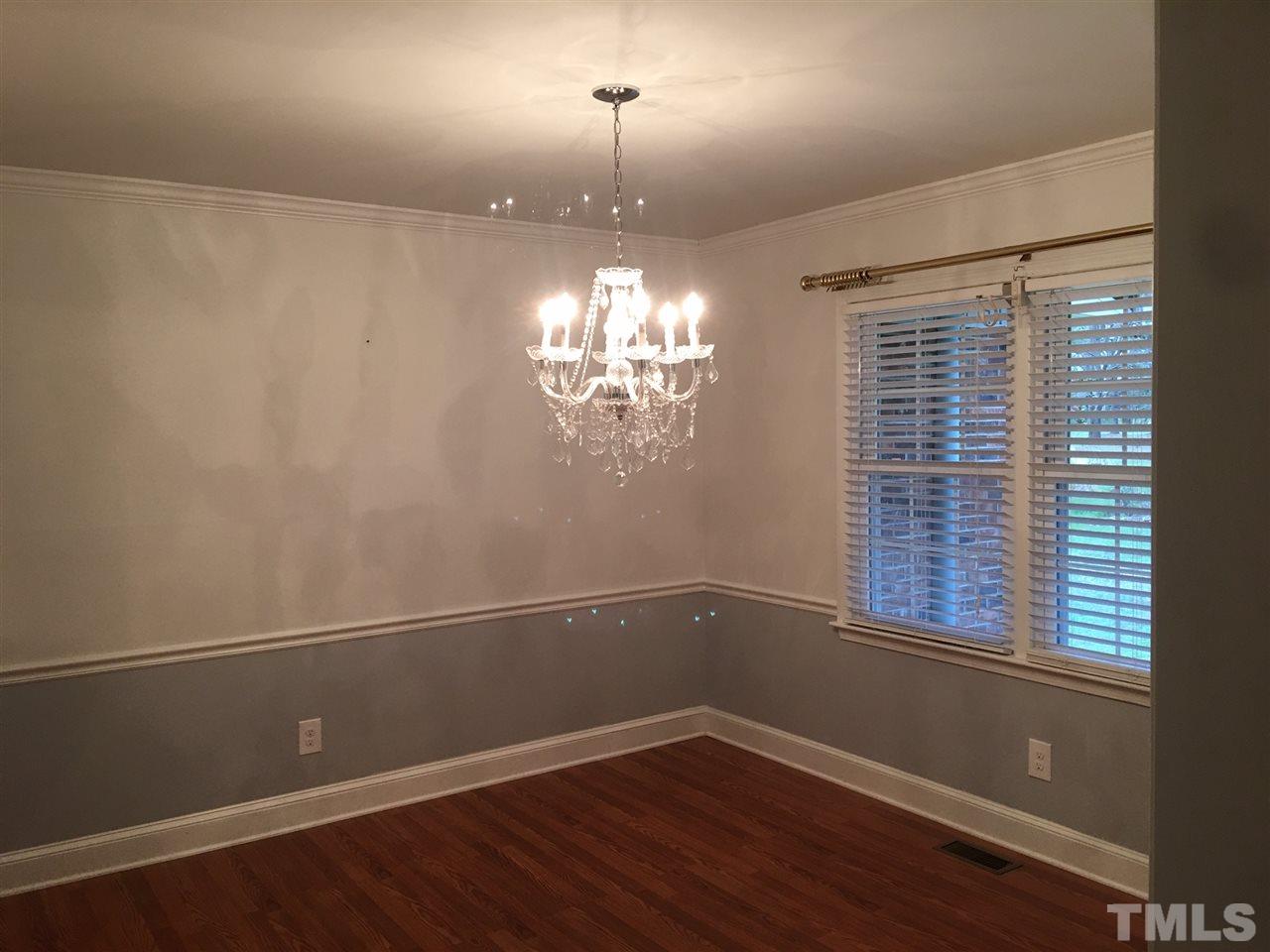 2225 Mill Hill Road Roxboro, NC 27574 - Photo 14 of 18 a view of a room with wooden floor and a window
