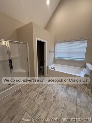 a view of a bathroom with sink and a window