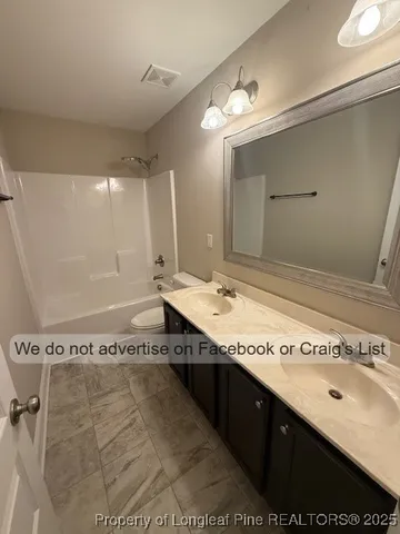 a bathroom with a sink a mirror and a bathtub