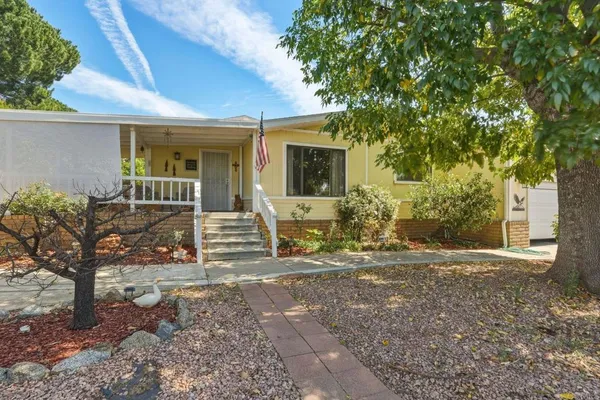 a front view of a house with garden