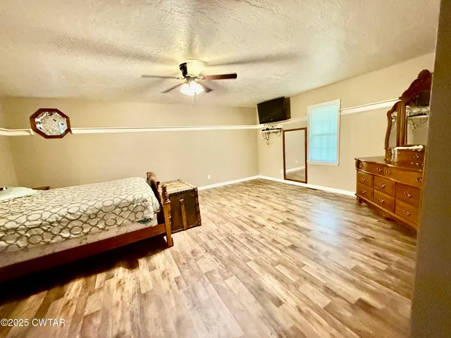 a view of a livingroom with wooden floor
