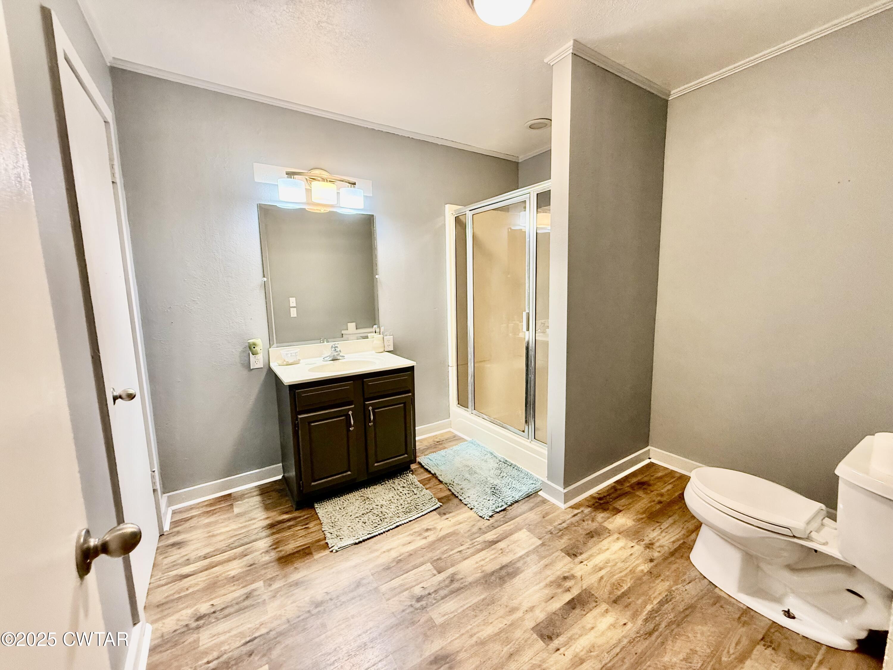 5021 McClard Road Union City, TN 38261 - Photo 17 of 21 a bathroom with a sink toilet and shower