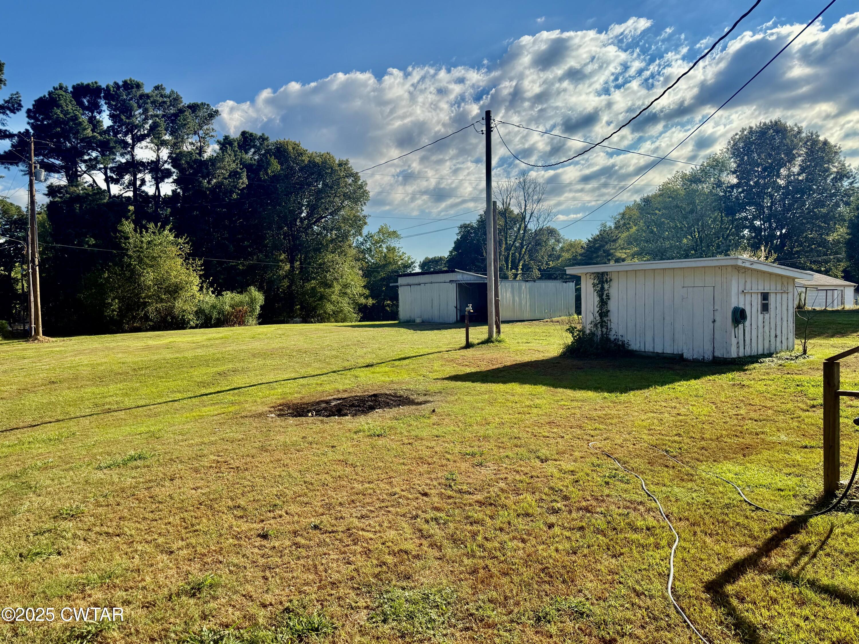 5021 McClard Road Union City, TN 38261 - Photo 18 of 21 a view of a swimming pool with an outdoor space