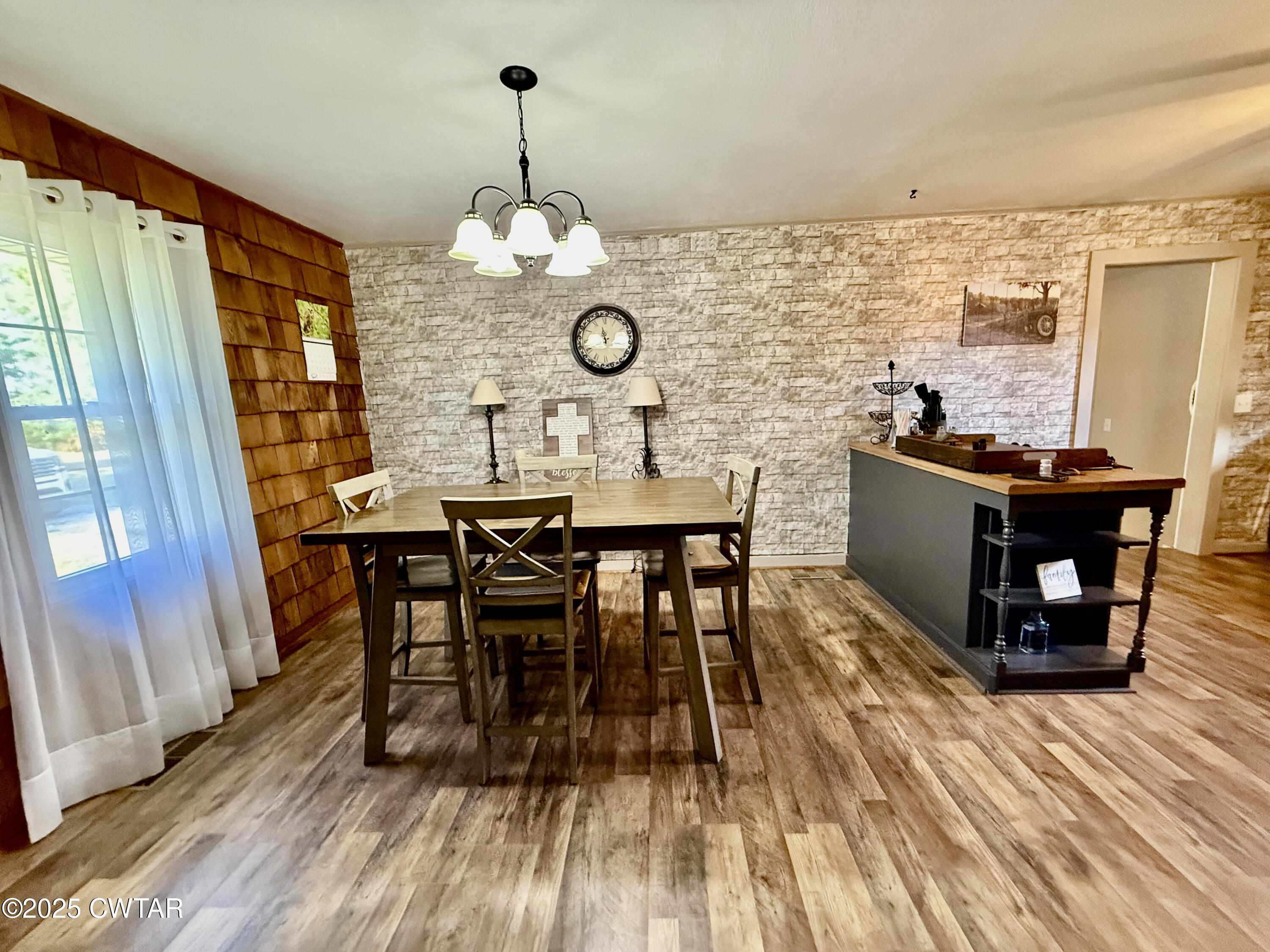 5021 McClard Road Union City, TN 38261 - Photo 9 of 21 a view of a dining room with furniture window and wooden floor