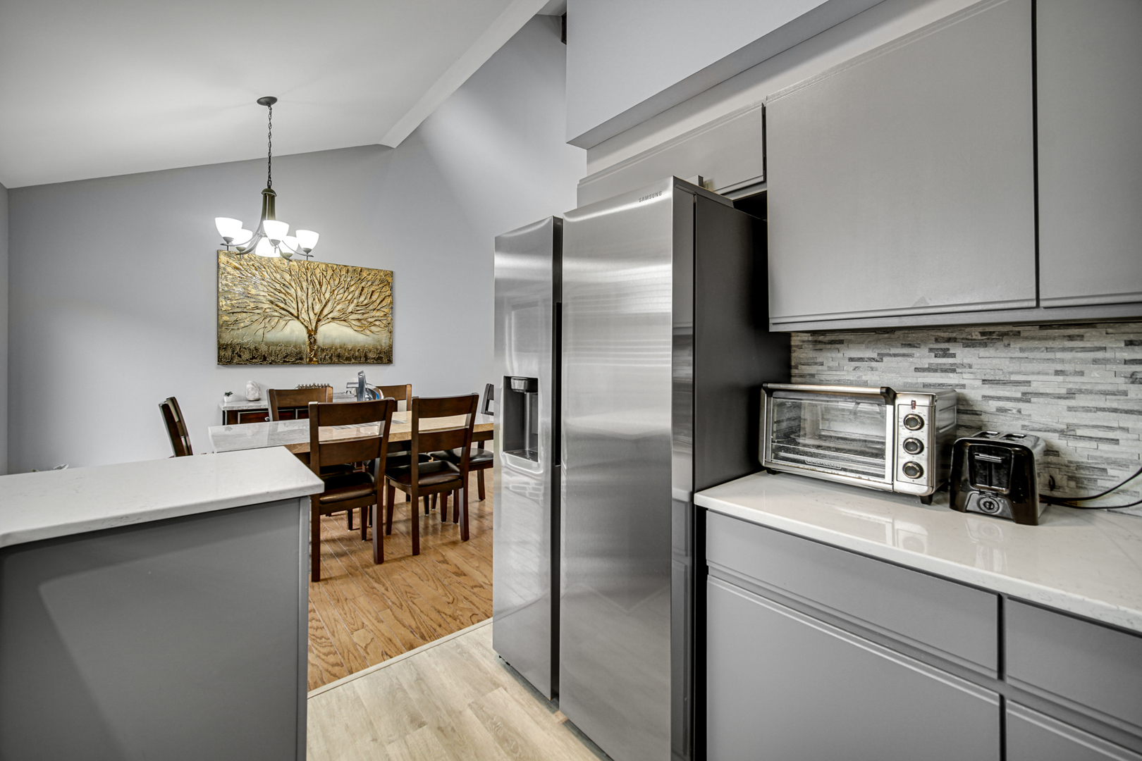 807 Summit Avenue Wauconda, IL 60084 - Photo 11 of 25 a kitchen with stainless steel appliances granite countertop a refrigerator a sink a stove and chairs