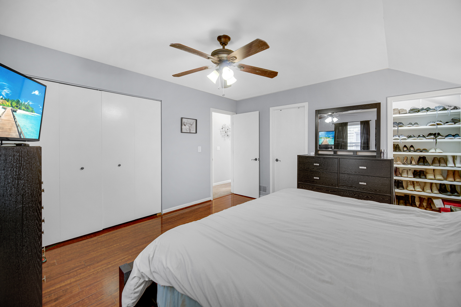 807 Summit Avenue Wauconda, IL 60084 - Photo 17 of 25 a bedroom with a large bed and a chandelier