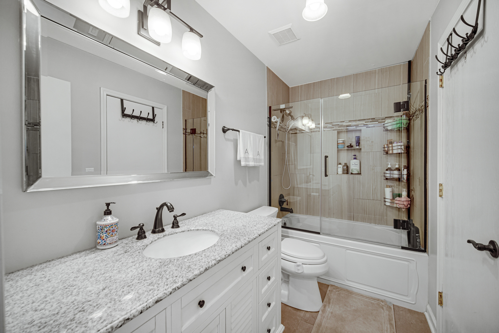 807 Summit Avenue Wauconda, IL 60084 - Photo 19 of 25 a bathroom with a granite countertop sink toilet and shower