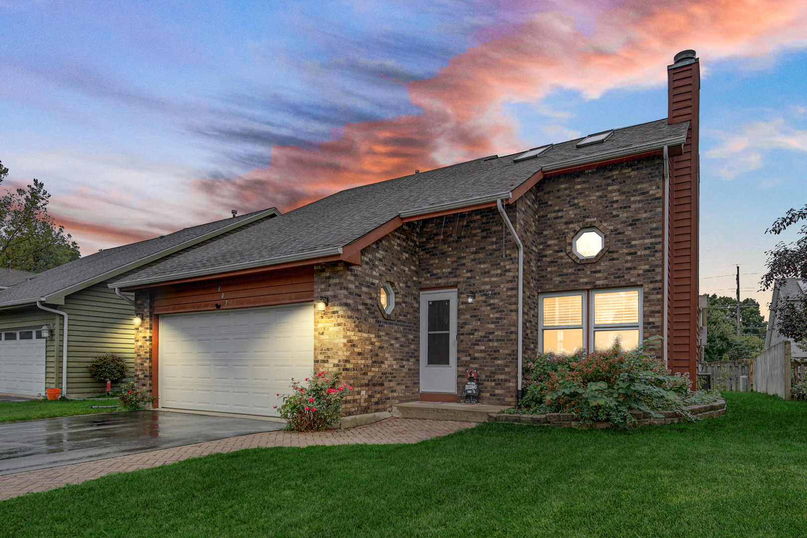 807 Summit Avenue Wauconda, IL 60084 - Photo 2 of 25 a front view of a house with a garden and yard
