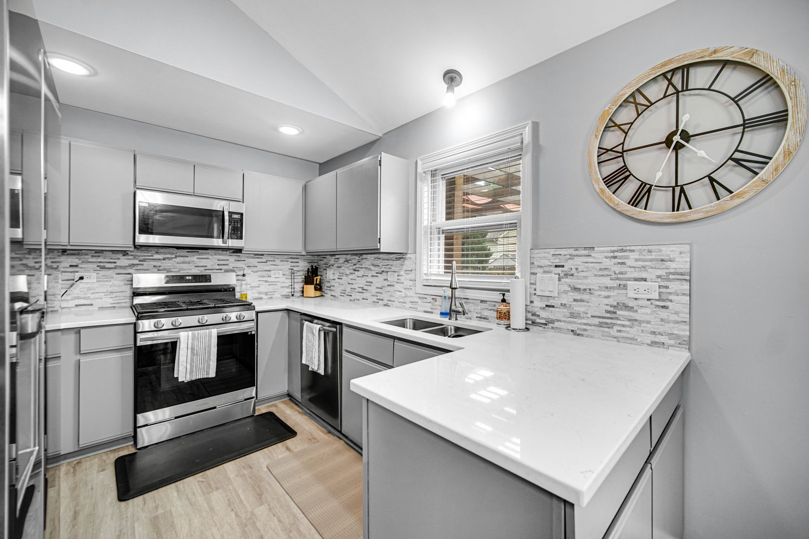 807 Summit Avenue Wauconda, IL 60084 - Photo 9 of 25 a kitchen with a stove a sink and a microwave
