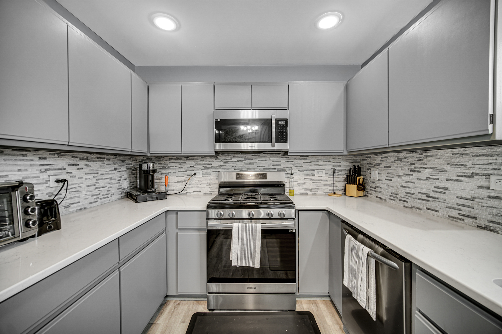807 Summit Avenue Wauconda, IL 60084 - Photo 10 of 25 a kitchen with granite countertop a stove sink and cabinets