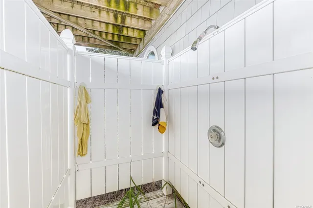 a view of storage and utility room with a window