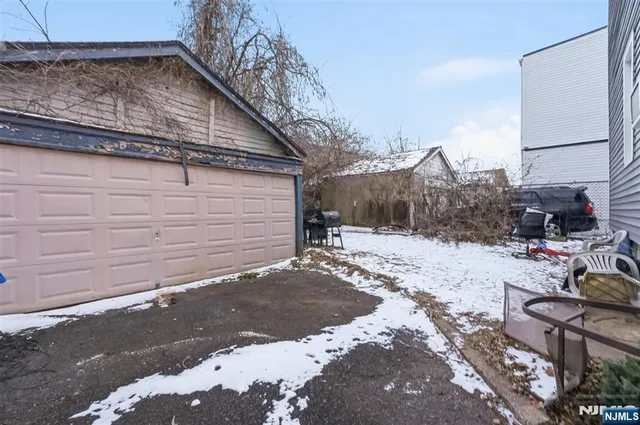 a view of a backyard of the house