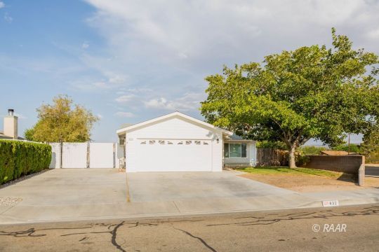 432 Ashton Street Ridgecrest, CA 93555 - Photo 2 of 31 a view of garage with tree