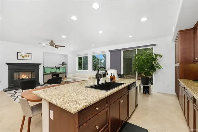a kitchen with sink cabinets and living room