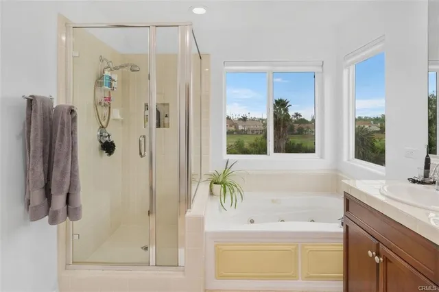 a bathroom with a bathtub and a sink