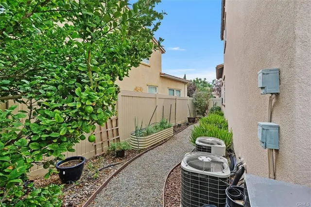 a view of a chairs and table in backyard