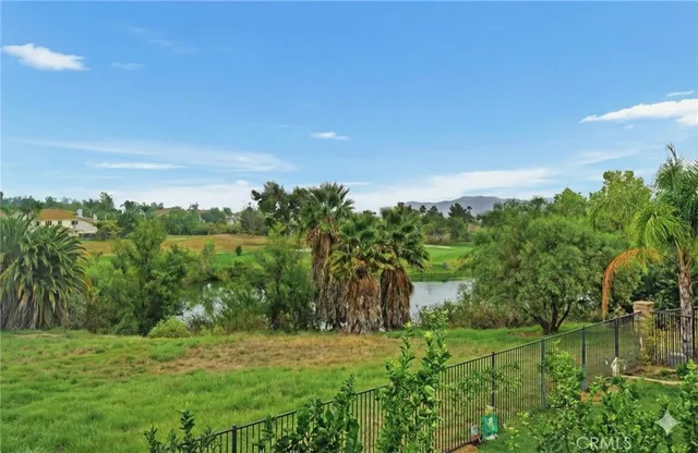 a big yard with lots of green space and deers