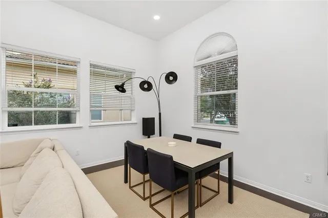 a view of a workspace room with windows