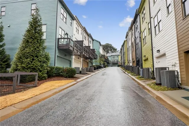 a view of swimming pool with outdoor seating and plants