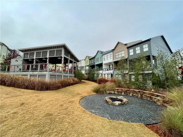 an aerial view of a residential apartment building with a yard