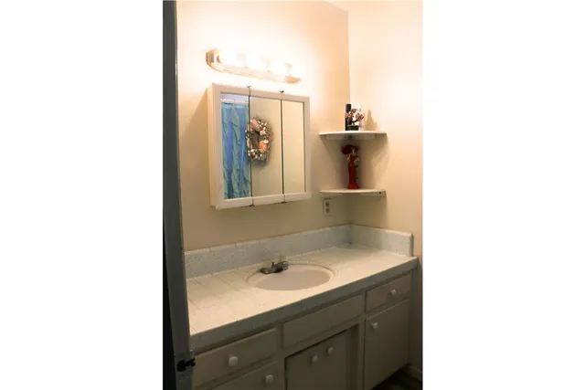 a bathroom with a sink and toilet